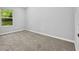 Bright bedroom with neutral walls, carpeted floor, offering a calm and inviting atmosphere at 1080 Westmont Sw Rd, Atlanta, GA 30311