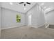 Bright bedroom with neutral walls, carpeted floor, and a ceiling fan, offering a calm and inviting atmosphere at 1080 Westmont Sw Rd, Atlanta, GA 30311