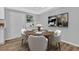 Bright dining area featuring a table set for four, with wood floors, neutral colors, and lots of light at 1080 Westmont Sw Rd, Atlanta, GA 30311