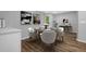 Cozy dining area featuring a table set for four, with wood floors, and neutral colors at 1080 Westmont Sw Rd, Atlanta, GA 30311