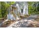 Charming exterior showcasing a well-maintained yard, wooden stairs, and a cozy front porch at 1080 Westmont Sw Rd, Atlanta, GA 30311