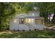 Charming two-story home with a welcoming front porch and a freshly painted exterior at 1080 Westmont Sw Rd, Atlanta, GA 30311