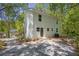 Modern home exterior featuring sleek lines, multiple windows, and natural surroundings at 1080 Westmont Sw Rd, Atlanta, GA 30311