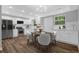 Well-lit kitchen area featuring new appliances, ample cabinet space, and a breakfast nook at 1080 Westmont Sw Rd, Atlanta, GA 30311