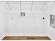 Laundry closet connections feature vinyl flooring, white walls, and white trim at 1080 Westmont Sw Rd, Atlanta, GA 30311