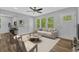 Inviting living room with wood floors, two doors, a comfortable sofa and lots of natural light at 1080 Westmont Sw Rd, Atlanta, GA 30311