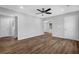 Living room features wood-look floors, neutral gray walls, and an open floor plan to other spaces at 1080 Westmont Sw Rd, Atlanta, GA 30311