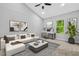 Bright living room featuring modern decor, vaulted ceilings, large windows, and a comfortable seating area at 1080 Westmont Sw Rd, Atlanta, GA 30311