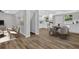 Open-concept living space with wood floors connecting the living and dining area at 1080 Westmont Sw Rd, Atlanta, GA 30311