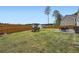 A spacious backyard with a wooden fence, a shed, a grill and outdoor furniture at 265 Riverclub Rd, Acworth, GA 30101