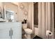 Stylish bathroom with white cabinets, neutral walls, and gray shower with floral wall decor at 265 Riverclub Rd, Acworth, GA 30101