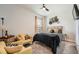 Cozy bedroom with plush carpeting, yellow accent decor, and natural light at 265 Riverclub Rd, Acworth, GA 30101