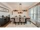 Formal dining room features modern décor, a stylish chandelier and ample natural light at 265 Riverclub Rd, Acworth, GA 30101