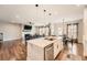 Open concept: modern kitchen flows into living room and dining area with stainless steel appliances at 265 Riverclub Rd, Acworth, GA 30101