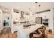 Modern kitchen features stainless steel appliances, an island with seating, and sleek white cabinetry at 265 Riverclub Rd, Acworth, GA 30101