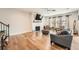 Spacious living room features hardwood floors, fireplace and bright windows with coverings at 265 Riverclub Rd, Acworth, GA 30101