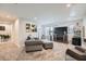 Open living room with carpet, a TV, and large sectional sofa at 265 Riverclub Rd, Acworth, GA 30101