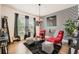 Chic living room featuring accent wall, hardwood floors, and bright, natural light at 265 Riverclub Rd, Acworth, GA 30101