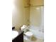 Functional bathroom with a tiled shower-tub combo, vanity with sink, and standard toilet at 476 Elm Nw St, Atlanta, GA 30318