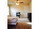 A cozy bedroom with neutral carpet and ceiling fan offers a relaxing retreat at 476 Elm Nw St, Atlanta, GA 30318