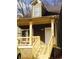 Charming craftsman-style home featuring a covered front porch, wooden steps, and fresh paint at 476 Elm Nw St, Atlanta, GA 30318