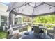 Relaxing outdoor deck featuring comfortable seating, dining area, and charming decorative lights at 4835 Liberty Rd, Villa Rica, GA 30180