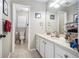 Bright bathroom with a tiled floor, neutral wall color, and framed art decor at 4835 Liberty Rd, Villa Rica, GA 30180