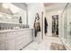 Beautiful bathroom with double vanity, large mirror, pendant lights, and a walk-in closet at 4835 Liberty Rd, Villa Rica, GA 30180