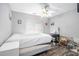 Bright bedroom with a ceiling fan, window with blinds, and neutral decor at 4835 Liberty Rd, Villa Rica, GA 30180