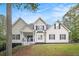 Charming two-story home with landscaped front yard and inviting entrance, enhanced by blue skies and mature trees at 4835 Liberty Rd, Villa Rica, GA 30180