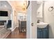 View from hallway towards dining area, living area, and adjacent half-bath at 4835 Liberty Rd, Villa Rica, GA 30180
