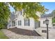 Well-maintained home with stone walkway, attached garage, lovely side yard, and professional landscaping around the house at 4835 Liberty Rd, Villa Rica, GA 30180