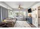 Cozy sun room with ceiling fan, TV, sleeper sofa, and lots of natural light at 4835 Liberty Rd, Villa Rica, GA 30180