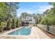 Residential in-ground swimming pool and outdoor space set within a tree-lined backyard at 4835 Liberty Rd, Villa Rica, GA 30180