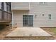 Back of house featuring a concrete patio and sliding glass door with access to the backyard at 5975 Tate Dr, Austell, GA 30106