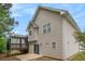 Exterior view showcasing siding, upper windows, and a charming deck with pergola at 5975 Tate Dr, Austell, GA 30106