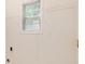 Bright laundry area with window and ample shelving for storage and organization at 5975 Tate Dr, Austell, GA 30106