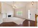 Inviting living room features high ceilings, a fireplace, neutral carpet, and hardwood floors at 5975 Tate Dr, Austell, GA 30106