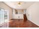 Bright living room with hardwood floors, staircase, and sliding door access to the outdoors at 5975 Tate Dr, Austell, GA 30106