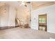 Open-concept living room boasts high ceilings, fireplace, hardwood floors, and staircase access at 5975 Tate Dr, Austell, GA 30106
