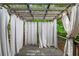 Inviting outdoor deck area with a wood pergola and curtains for added privacy and shade at 5975 Tate Dr, Austell, GA 30106