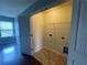 Walk-in closet with door, wire shelving, and window providing natural light at 2166 Villa Spring Ct, Dacula, GA 30019