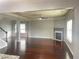 Open concept living area includes hardwood floors, fireplace, chandelier, and staircase at 2166 Villa Spring Ct, Dacula, GA 30019