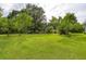 Expansive grassy backyard with scattered trees and landscaping features at 4812 Pamela Nw Ct, Acworth, GA 30101
