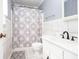 Bathroom featuring a vanity, tile floors, and a shower with a patterned curtain at 4812 Pamela Nw Ct, Acworth, GA 30101