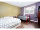 This bedroom features hardwood floors and windows that let in natural light at 4812 Pamela Nw Ct, Acworth, GA 30101