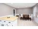 Bright dining area features a table set for six next to the island with a butcher block countertop at 4812 Pamela Nw Ct, Acworth, GA 30101
