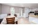 Bright dining area has an exit to the backyard and is open to the kitchen with white cabinets at 4812 Pamela Nw Ct, Acworth, GA 30101
