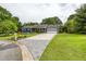 Inviting home with a long driveway leading to an attached garage and a beautifully landscaped front yard at 4812 Pamela Nw Ct, Acworth, GA 30101