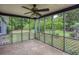 Charming screened porch with stone flooring, ceiling fan and views of the expansive backyard at 4812 Pamela Nw Ct, Acworth, GA 30101